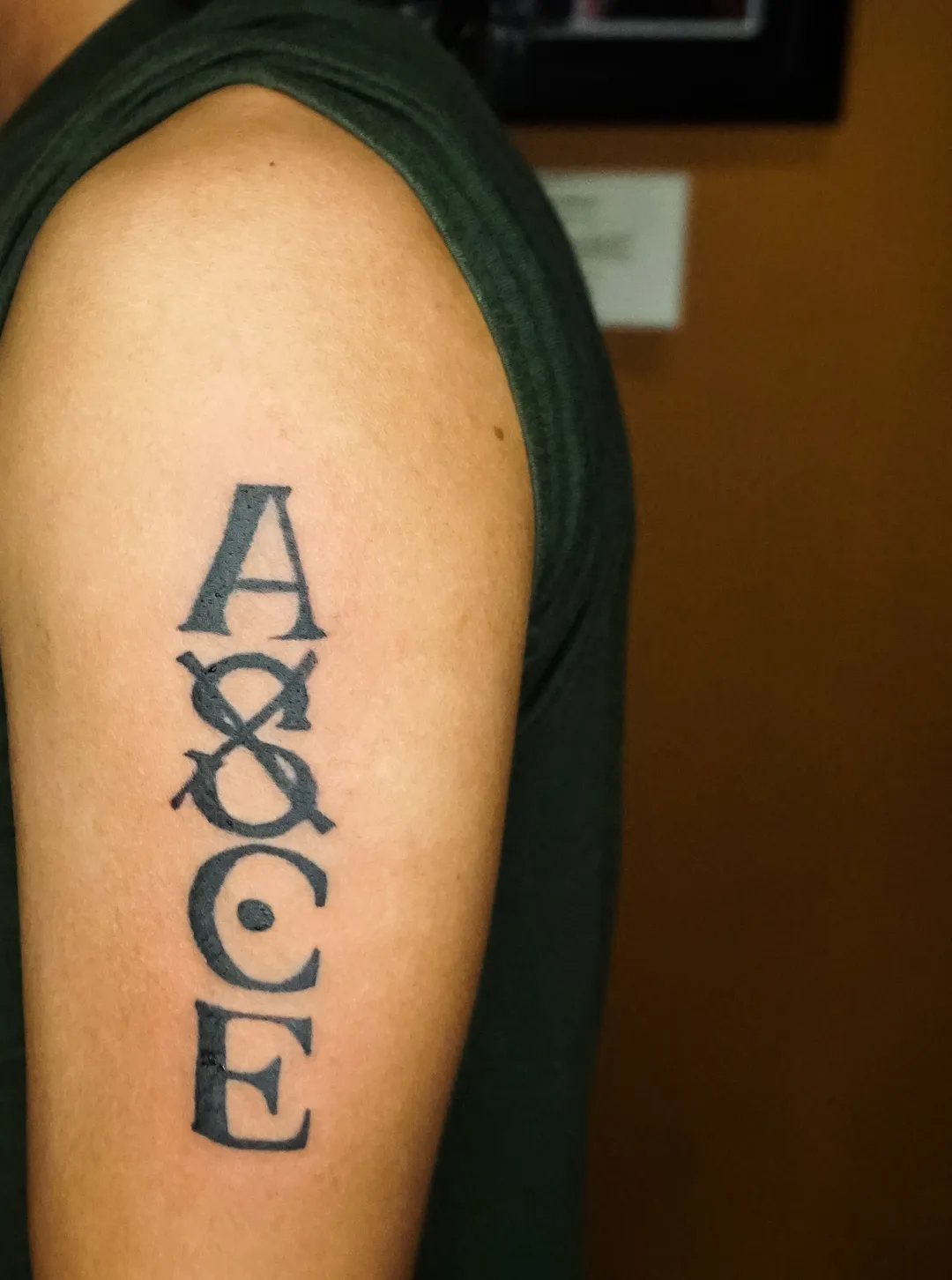 Blackletter monogram lettering tattoo by Kin, Blacklow Studio Bali