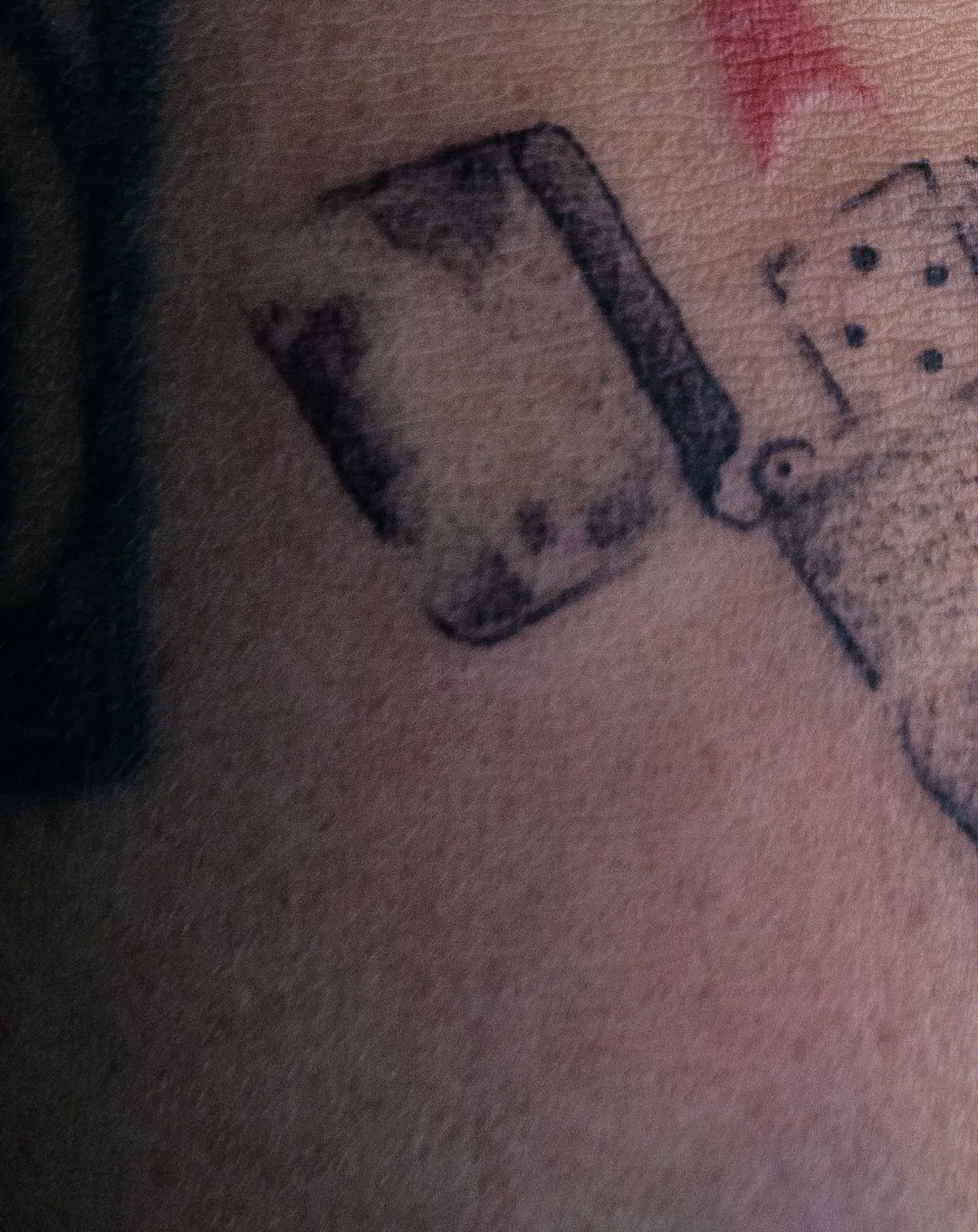 Blackwork Zippo lighter and dice tattoo by Kin, Blacklow Studio Bali