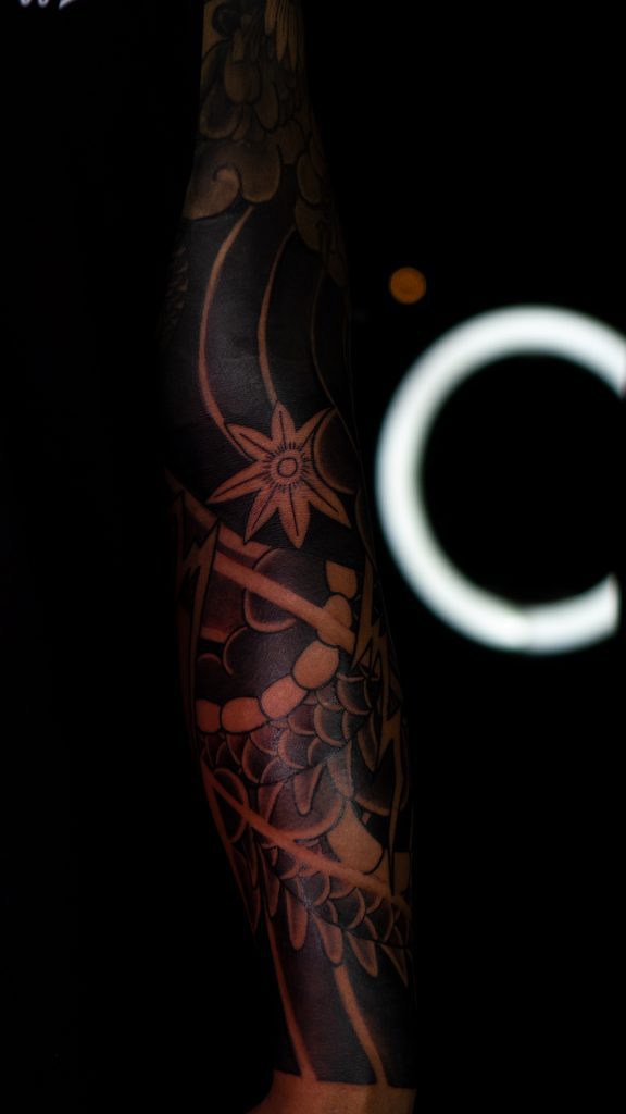 Blackwork Negative Space Tattoo